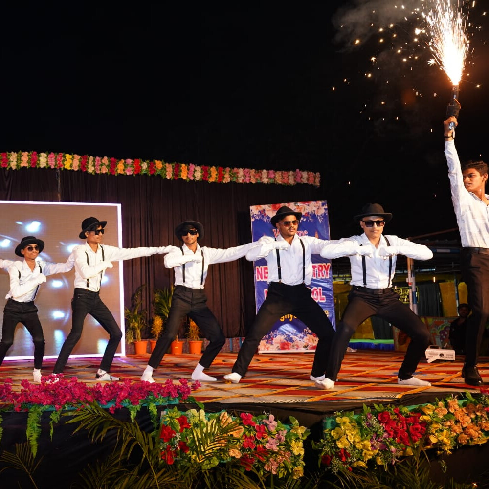 Students presenting science projects at the school science fair with colorful posters and models.