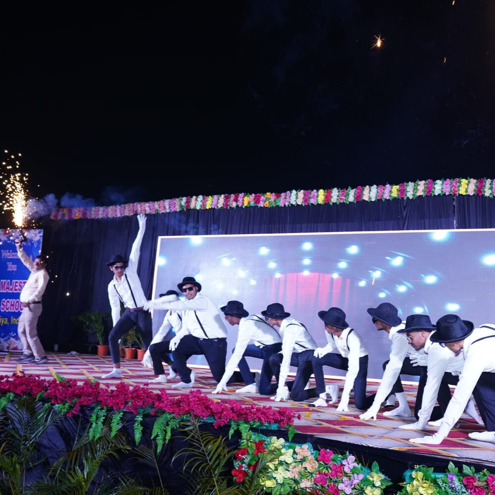 Students running in relay races during the school's annual sports day in a sunny field.